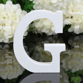 White letters in wood, approx. 8 cm high
