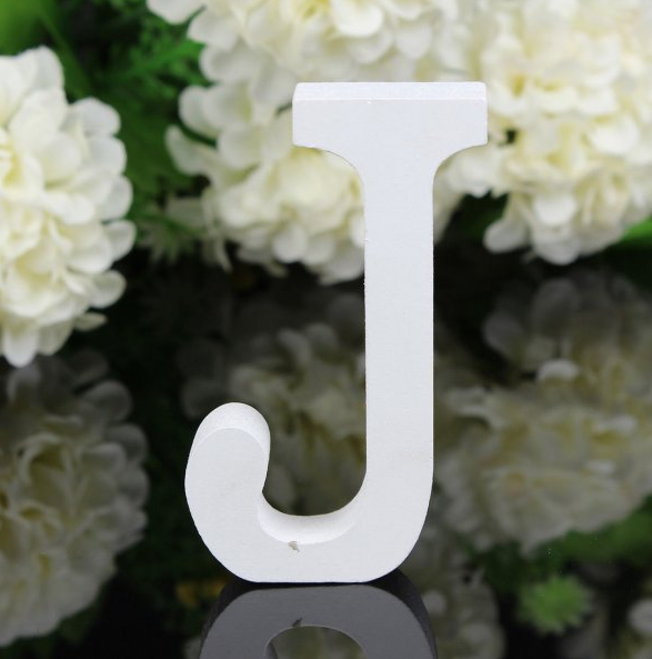 White letters in wood, approx. 8 cm high