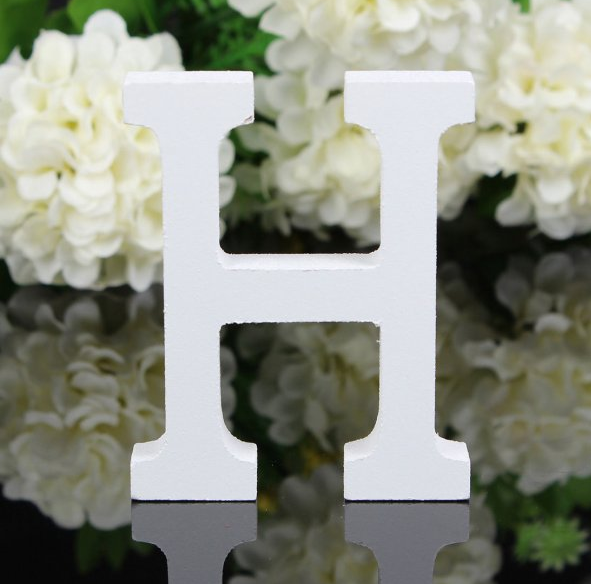 White letters in wood, approx. 8 cm high